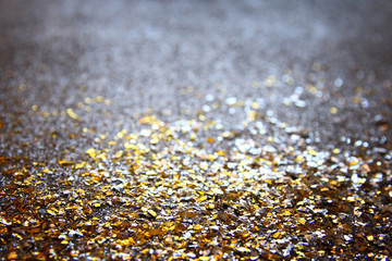 glitter lights background. gold and black. de focused