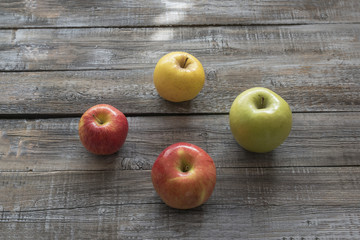 Organic apples on wooden boards background. Autumn concept