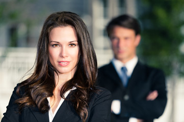 Businessman and Businesswoman outdoors downtown