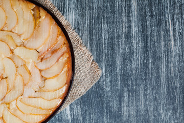 Beautiful organic pear pie. fresh fruit tart with gluten free crust on wooden table in rustic style