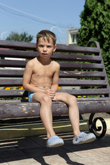 Child sitting on bench