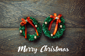 Top view Christmas wreath on wooden background with copy space.