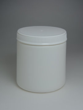 White plastic jar on a gray background