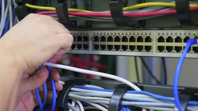 it engineer conducts maintenance work in the server room