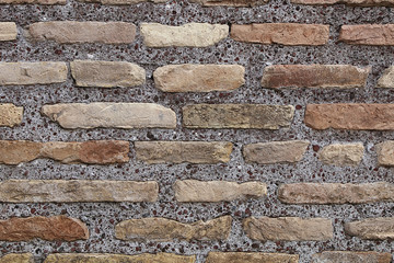 wall of various bricks and cement