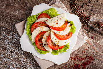whim on a white plate, on a linen towel on wooden background sca