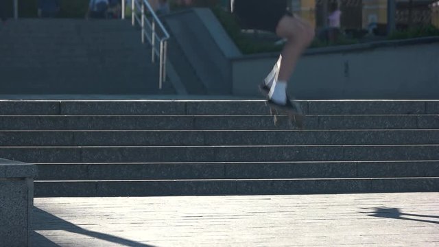 Skateboarder jumping in slow-mo. Guy on skateboard. Speed and coordination. Hobby of the youth.