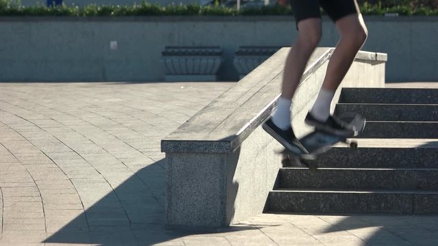 Skateboarder fails trick in slow-mo. Young guy with skateboard. Small mistake changes everything. Importance of coordination.