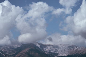 The picturesque mountain on the background of cloud flow. Wide angle