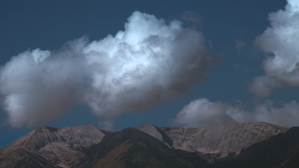 The picturesque mountain on the background of cloud flow. Wide angle