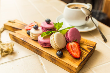 Several macaroons on desk decorated