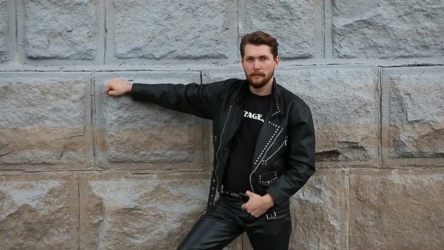 Handsome bearded man in black leather jackets