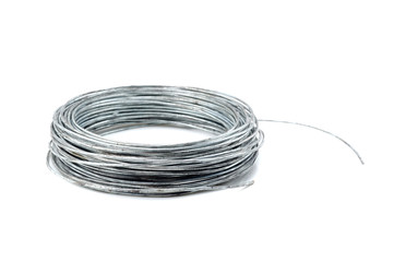 Stack of galvanized wires on white background
