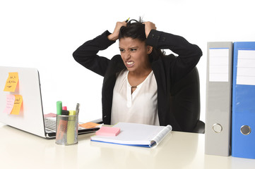  businesswoman suffering stress working at office computer desk worried desperate