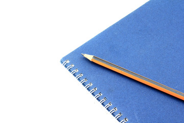 blue book diary and pencil isolate on white background