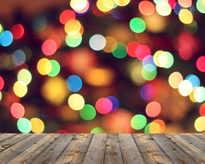 Empty wooden deck on blurred background with bokeh.