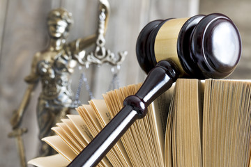 Law concept. Judge gavel, statue and book