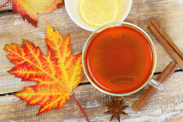 Autumn leaf, cup of tea, lemon, star anise and cinnamon
