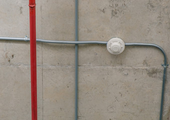 Extinguisher / Fire extinguisher on ceiling of parking lot.