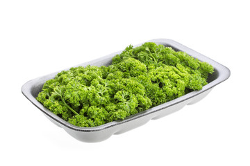 Parsley in plastic packaging for sale, isolated on white background