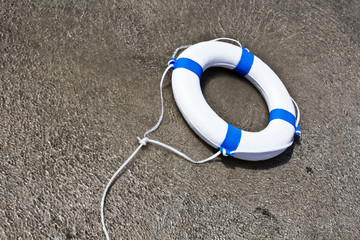 Nautical lifebuoy, lifebelt, life saver in clear water