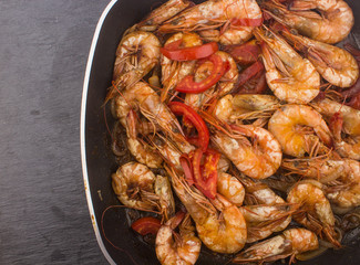 Cooked Fresh Shrimp with Tomato and Onions / Cooked Fresh Shrimp with Tomato and Onions Served in a plate on a Wooden ( Black Ceramic) background