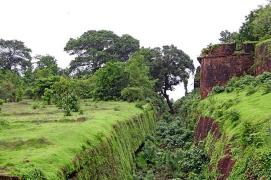 Remains of the deep trench made around for security in Cabo de Rama Fort in Goa, India. A centuries old fort, last owned by the Portuguese during their occupation of Goa.