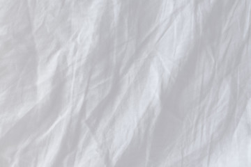 Top view of creased bedding sheets