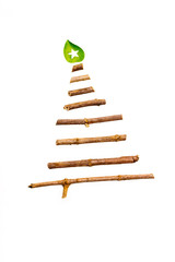 Christmas tree made from dry wooden sticks on white background