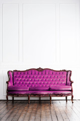 Ancient sofa in a retro interior. Vintage background