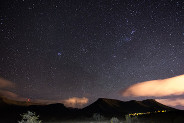 Obraz premium The starry sky captured Karoo National Park, South Africa, in winter. The Pleiades star cluster, Orion and Taurus Constellation clearly visible.