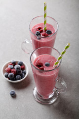 Berries smoothie in two glasses