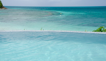 Infinity pool over Caribbean beach