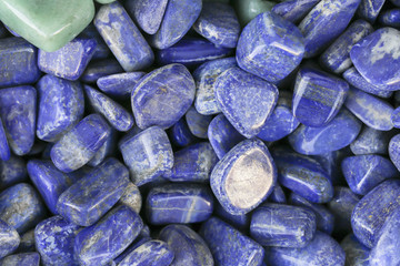 Closeup of various colorful stones quartz, marbles, ore minerals, gems use as ornament and decoration jewelry that contain spiritual force human believes