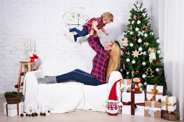 Christmas concept - mother and her little daughter with Christma