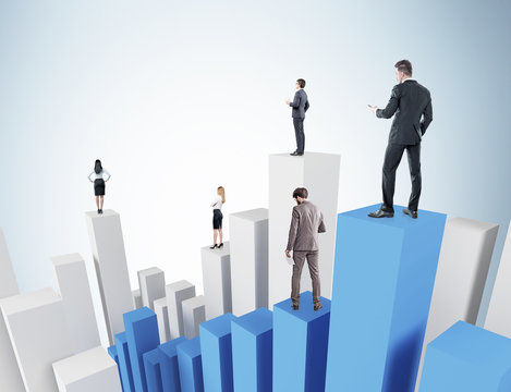 Businesspeople on bar chart