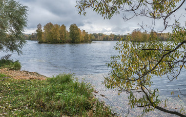 Autumn landscape in Moscow, Strogino, the river and the small island with the trees