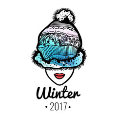 The face of the girl in winter hat with watercolor background