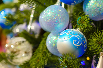 Obraz na płótnie Canvas Christmas decorations on artificial fir.