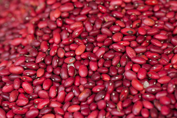 Texture of raw red bean selling on interwoven bamboo basket in fresh local market, Vietnam
