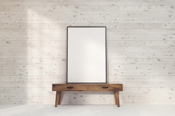 Vertical poster with black frame on table