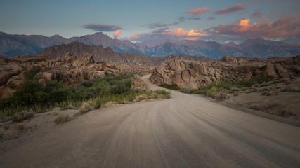 View of a Curved Road and the Sierra Nevada from Alabama Hills at Sunrise