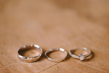 wedding rings on wooden background