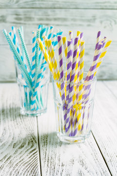 Stripped paper straws for cocktails in glasses