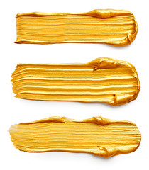 Set of golden paint strokes