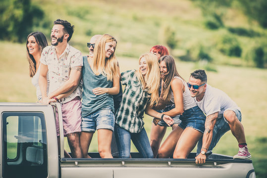 Friends Driving On Pickup Truck