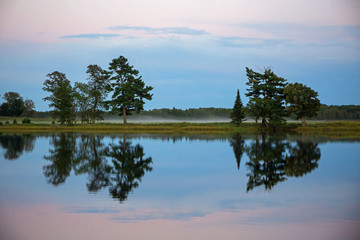 Obraz na płótnie Canvas Dusk over a calm Lake