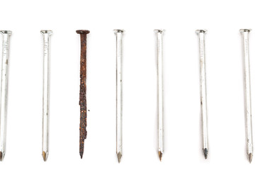 Old rusty nail and new ones