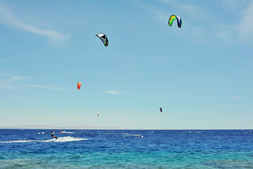 man riding on kite surf board on Red Sea, Dahab