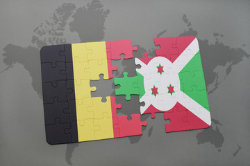 puzzle with the national flag of belgium and burundi on a world map background.